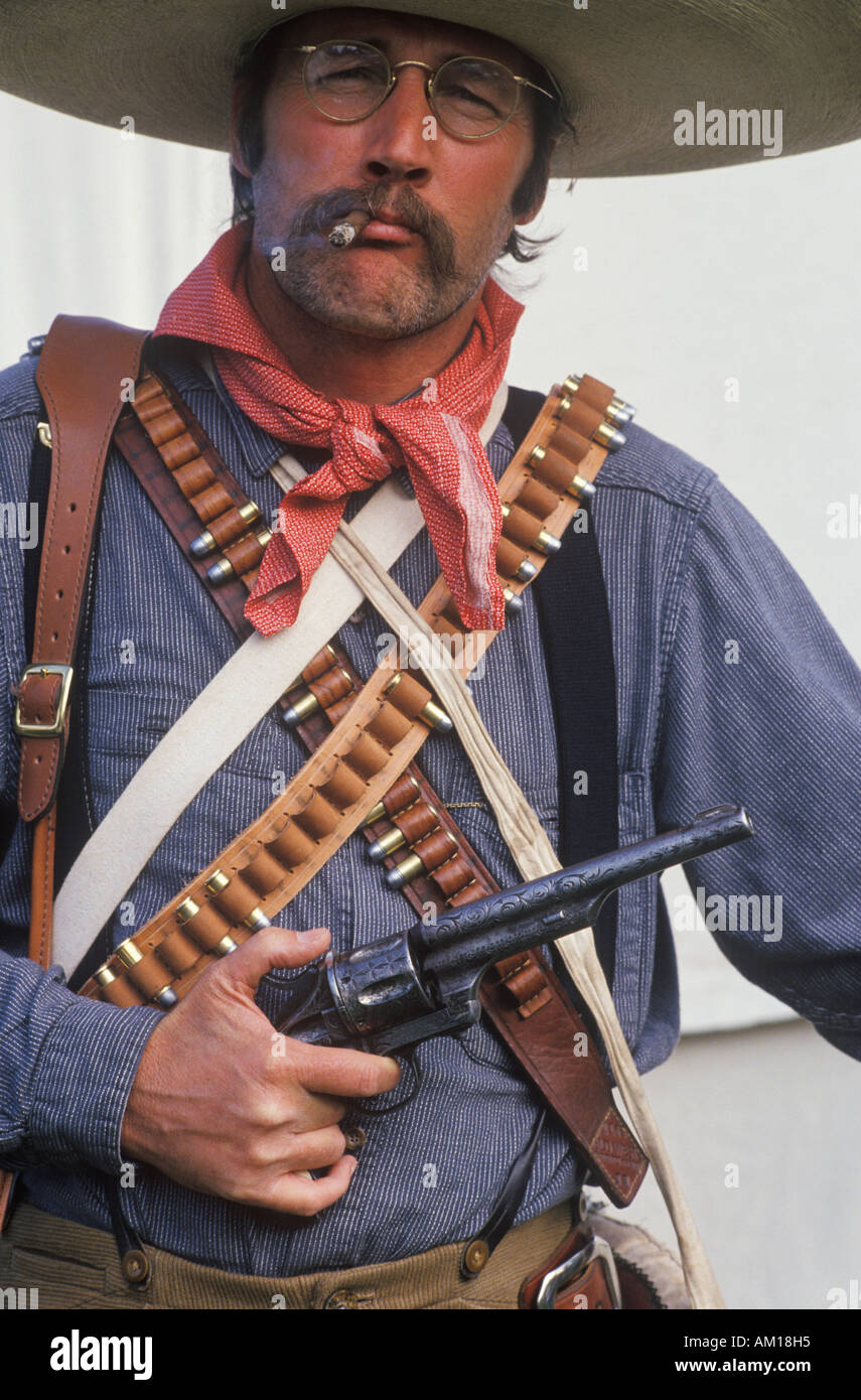 Portrait of Old West gunslinger participant with pistols CA Stock Photo