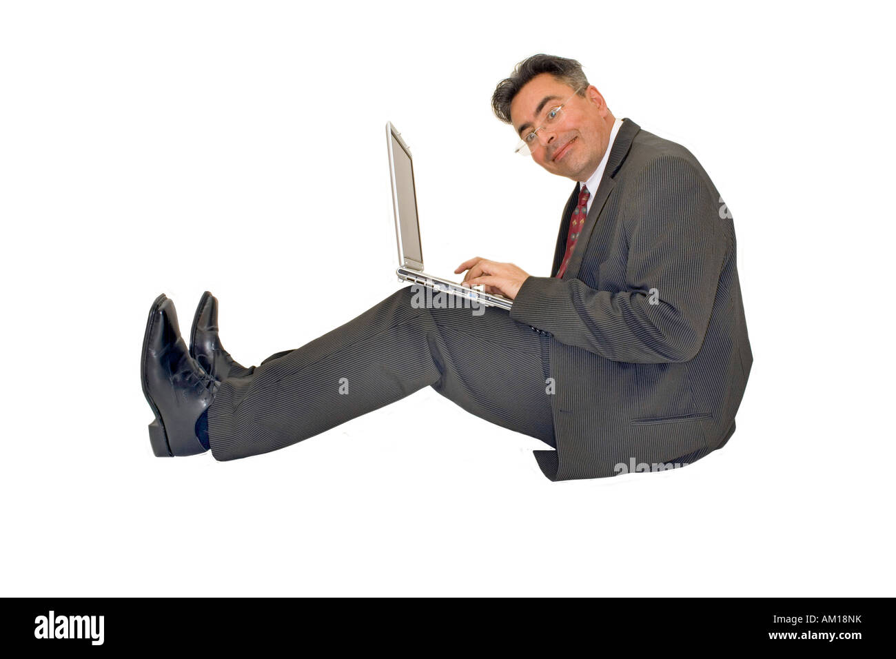 Businessman working with his notebook Stock Photo