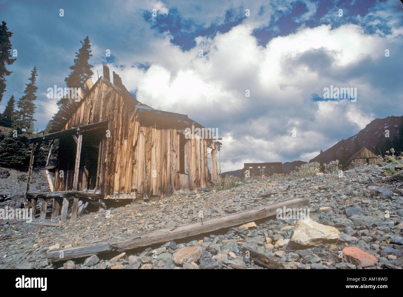 Abandoned wooden cabin on hillside Stock Photo