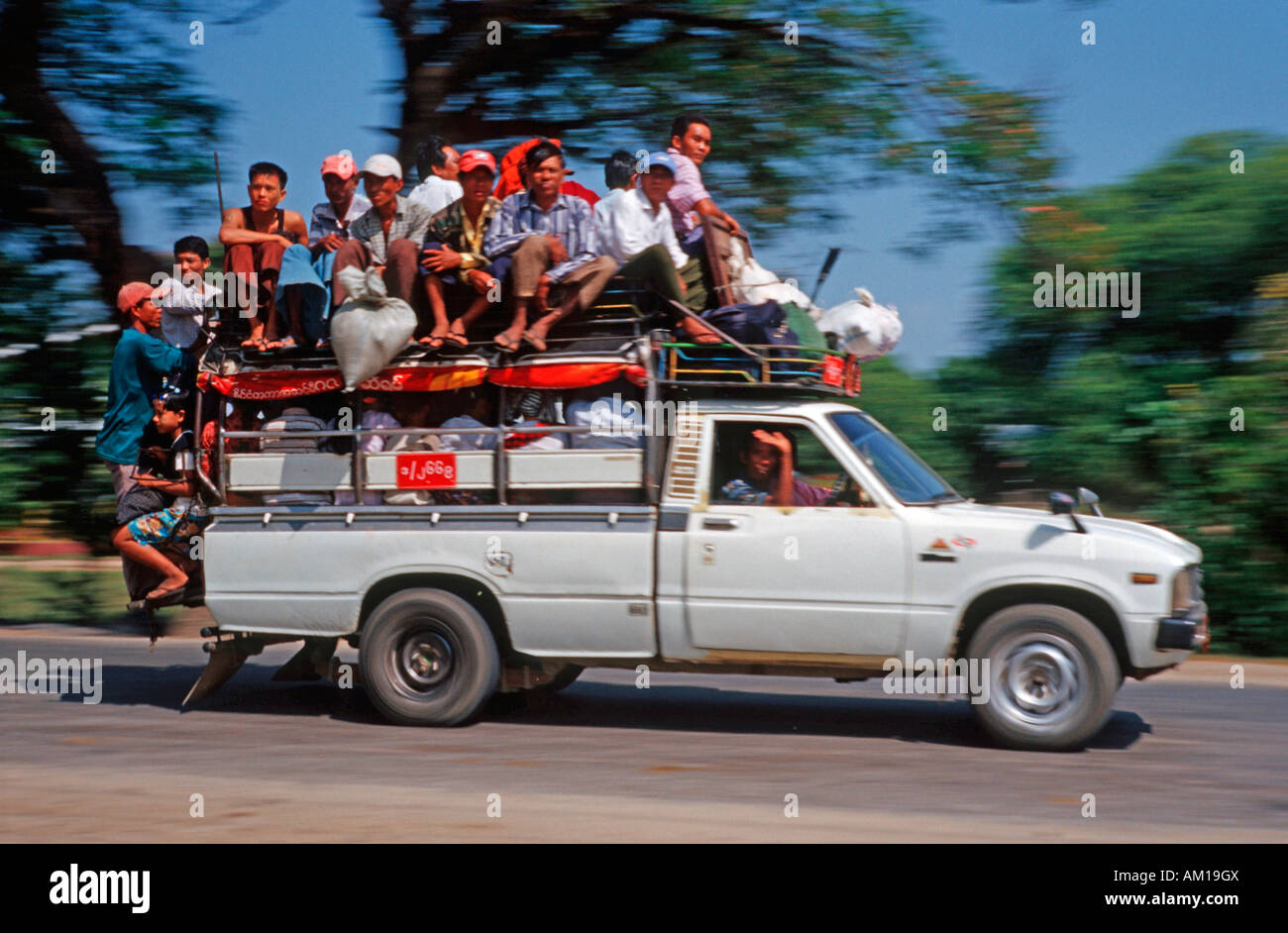 Overcrowded car, people on the roof, Burma, Asia Stock Photo
