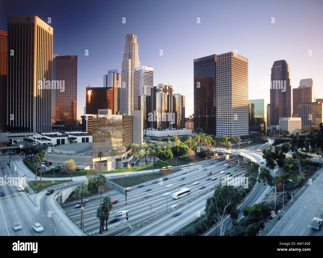 Downtown Los Angles with freeway traffic at sunset Stock Photo