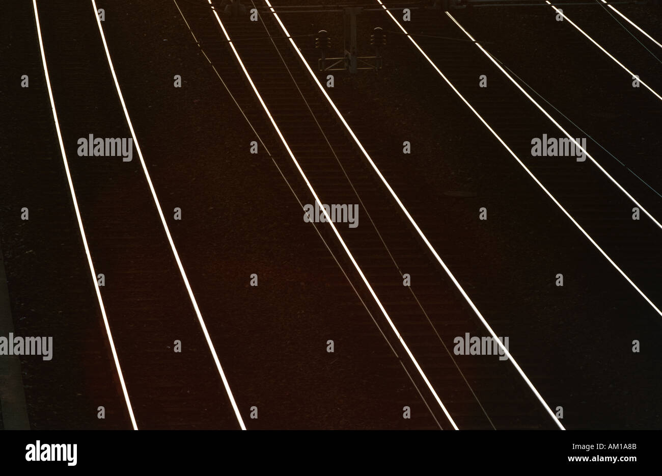 Railroad tracks reflecting sunlight Stock Photo
