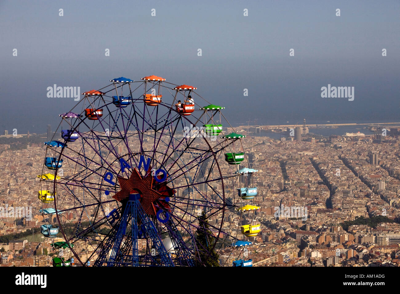View over the theme park Tibidabo with a big wheel and the city of Barcelona, Catalonia, Spain Stock Photo