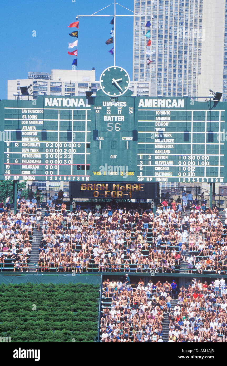 Long view of scoreboard and full bleachers during a professional baseball game Wrigley Field