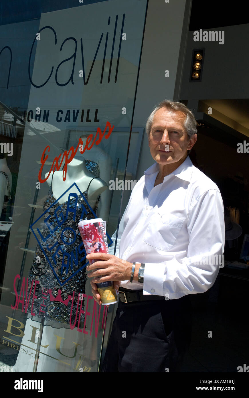 Fashion designer John Cavill in front of his shop, Melbourne Victoria, Australia Stock Photo