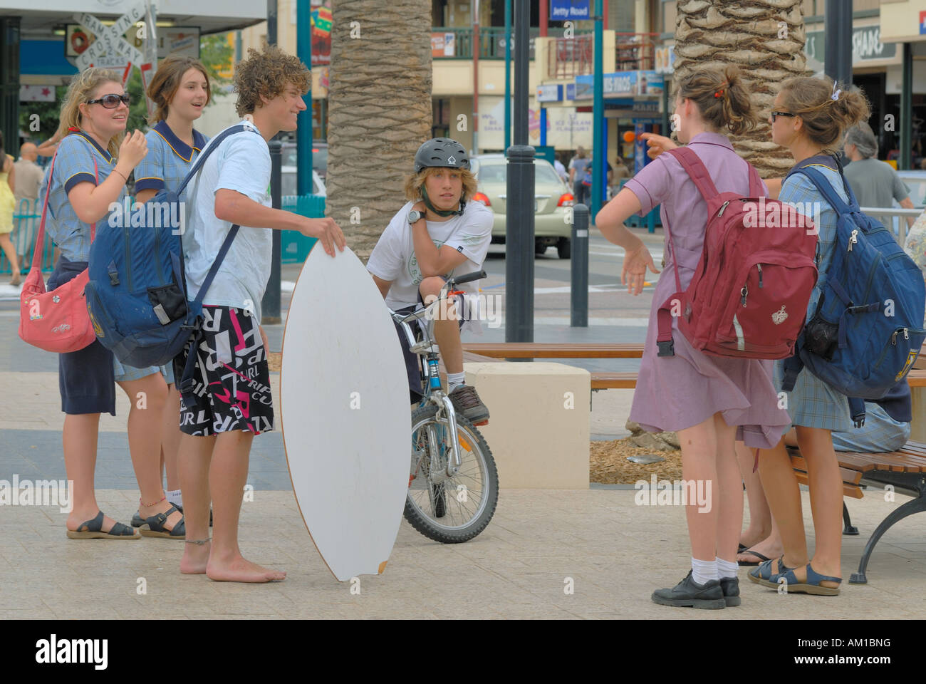 Teenagers with surf board, Glenelg, Adelaide, South Australia, Australia Stock Photo