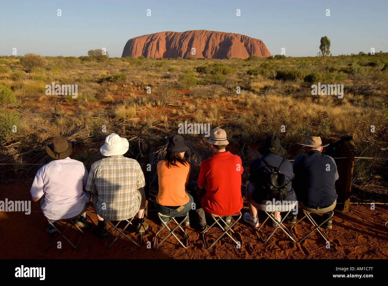 Ayers Rock, called Uluru, magic rock of the Aboriginals, tourists waiting for the sunset, Yulara, Ayers Rock, Northern Territor Stock Photo
