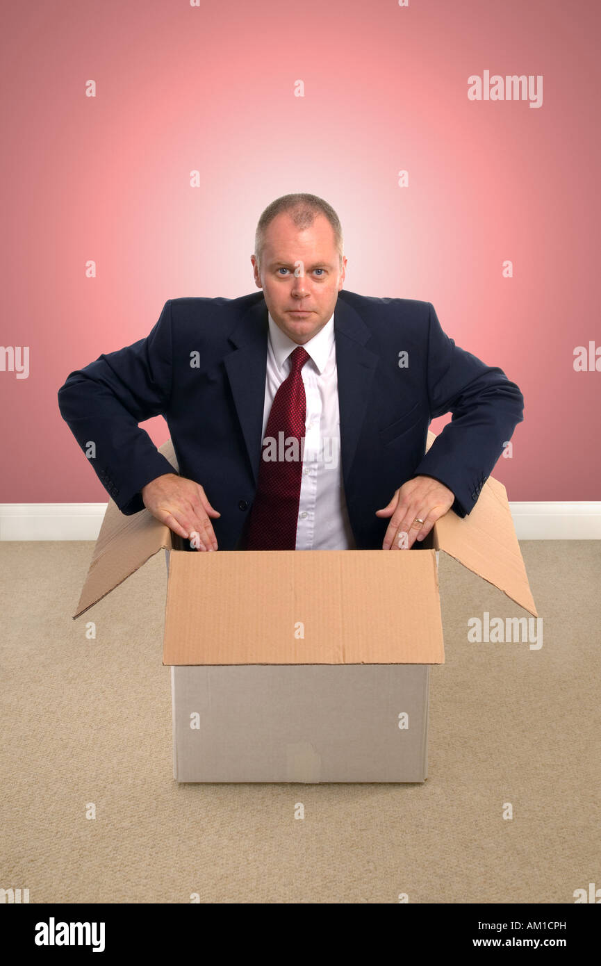 Businessman in a box Concept image Stock Photo