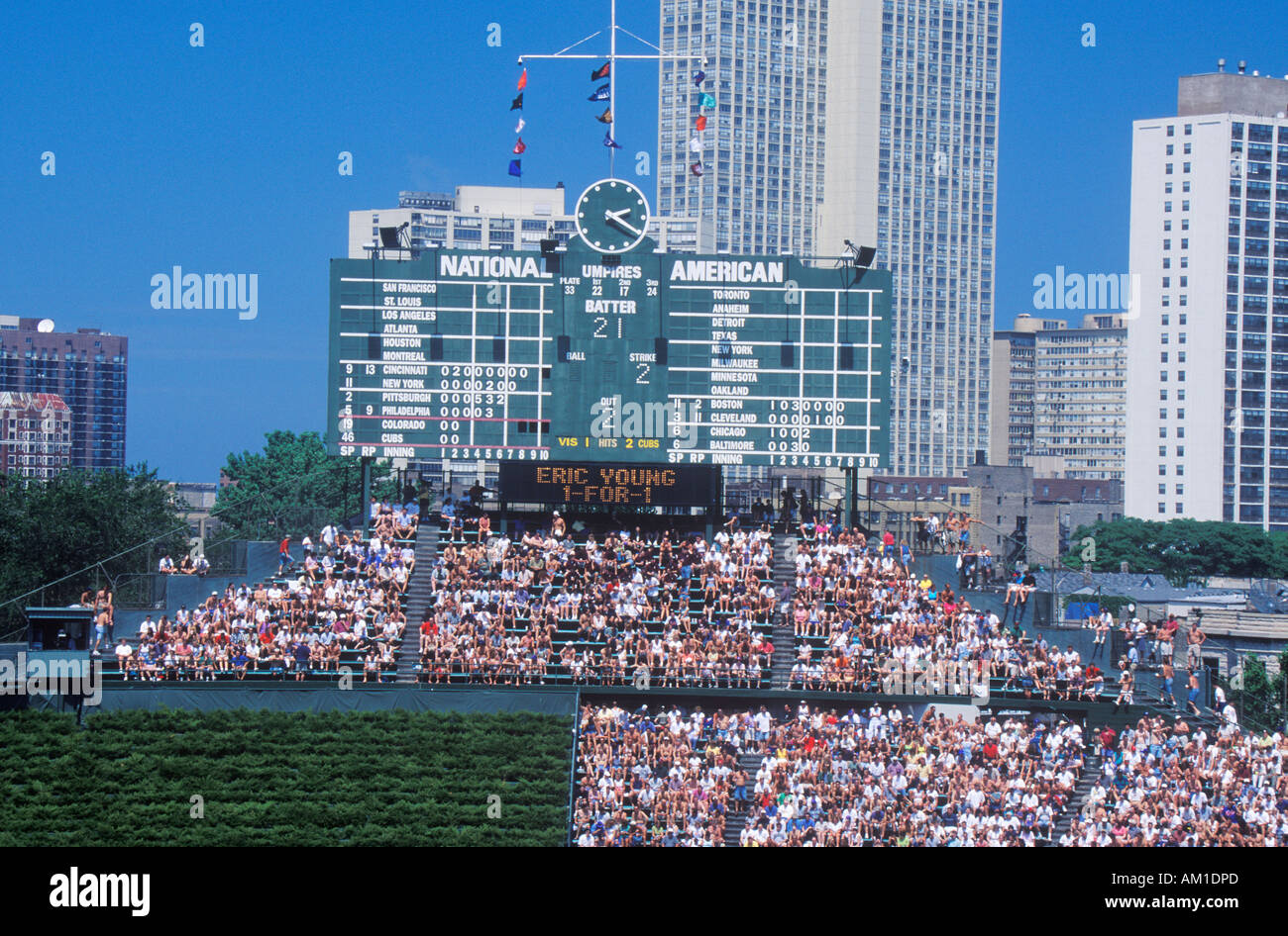 Long view of scoreboard and full bleachers during a professional