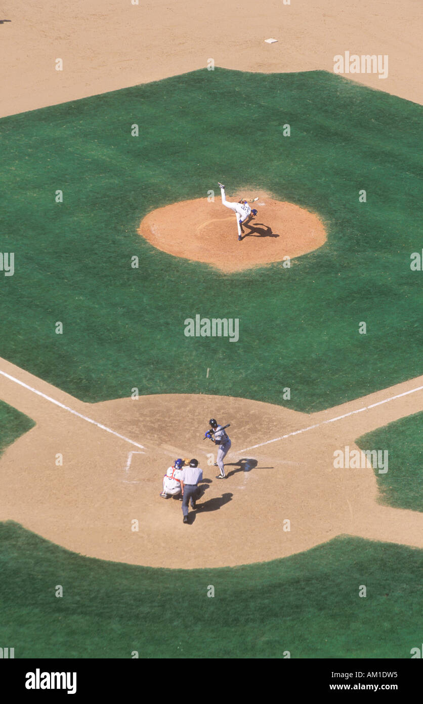 Long view of pitcher and catcher on diamond during professional