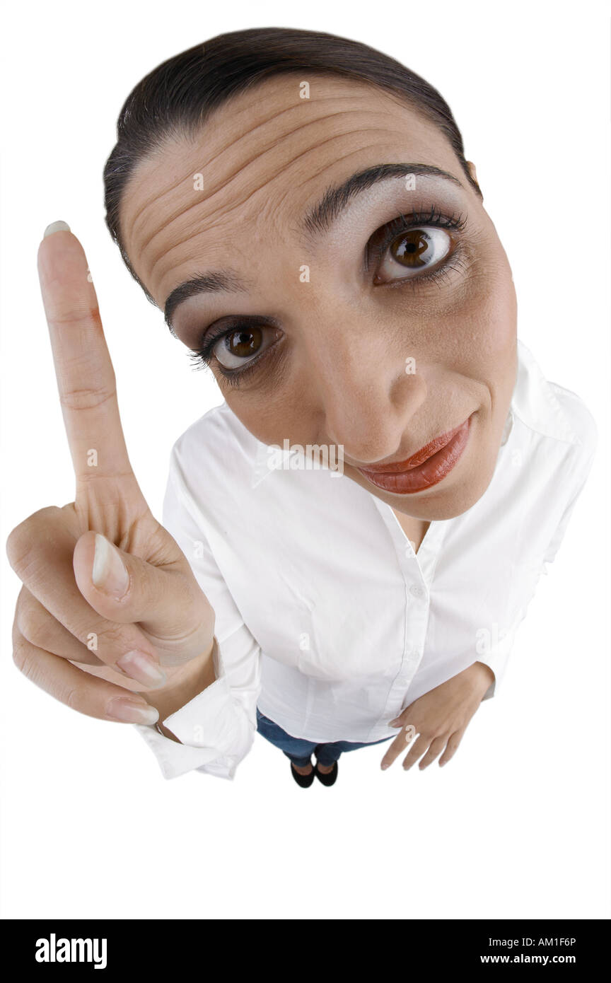 Woman upraised index finger. Made with fisheye lens. Stock Photo