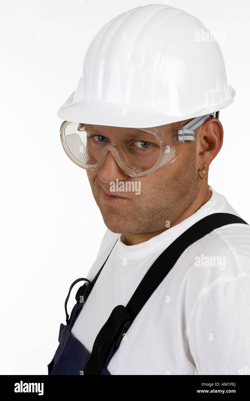 Craftsman with protective goggles and helmet Stock Photo