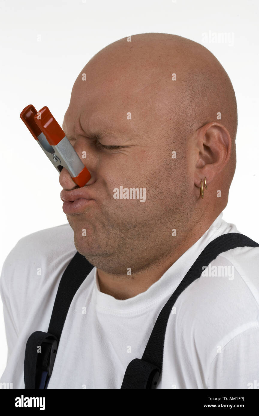 Man with clamp on the nose Stock Photo