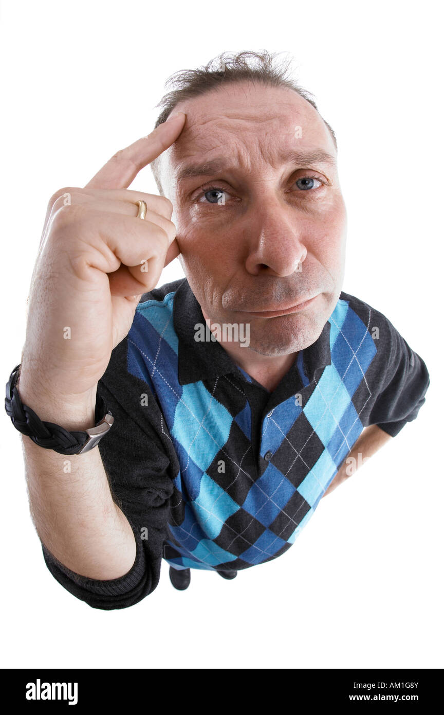 A man is thinking hard about something. Photo made with a fisheye-lens. Stock Photo
