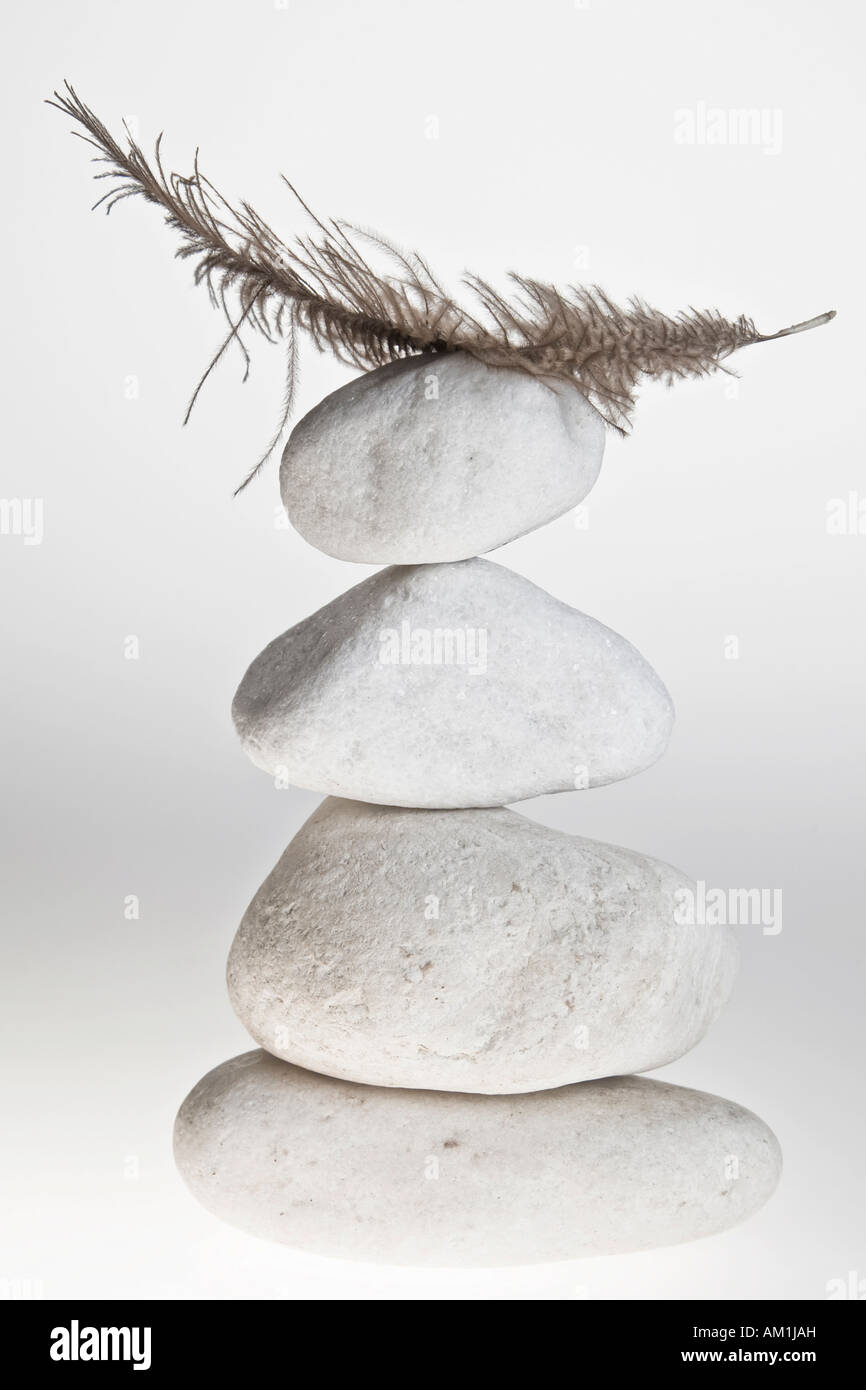 Pile of stones with feather Stock Photo