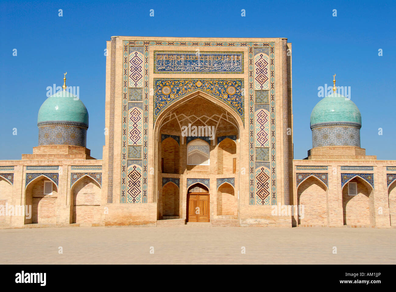 Entrance gate (iwan) decorated with colourful tiles and blue cupolas