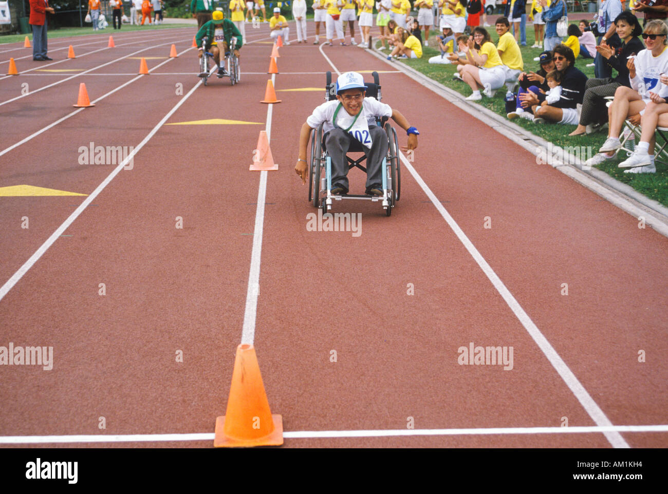 Wheelchair Special Olympics athlete competing in race approaching