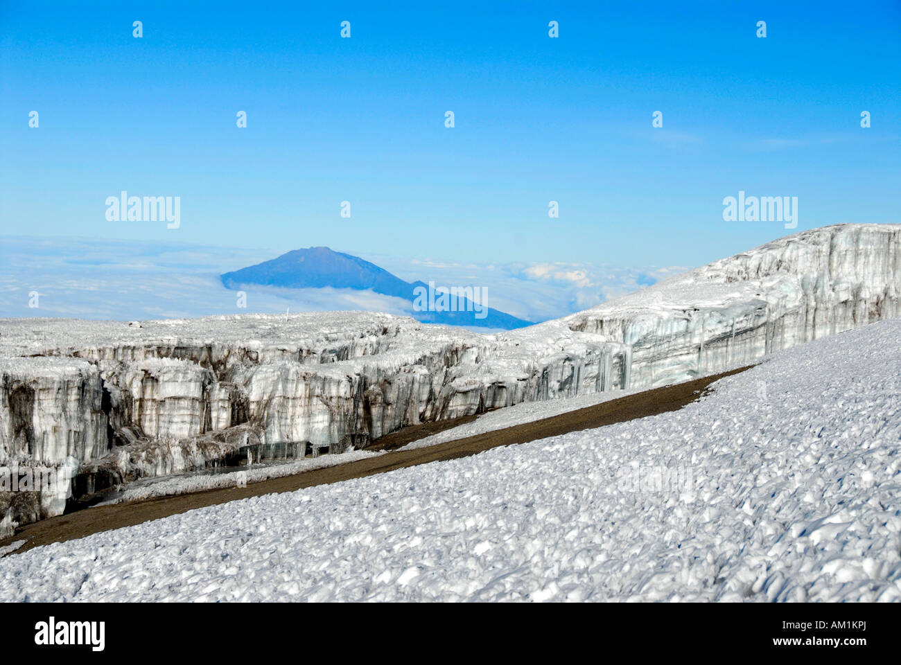 Kersten Gletscher gacier crater rim Kilimanjaro with Mount Meru in the