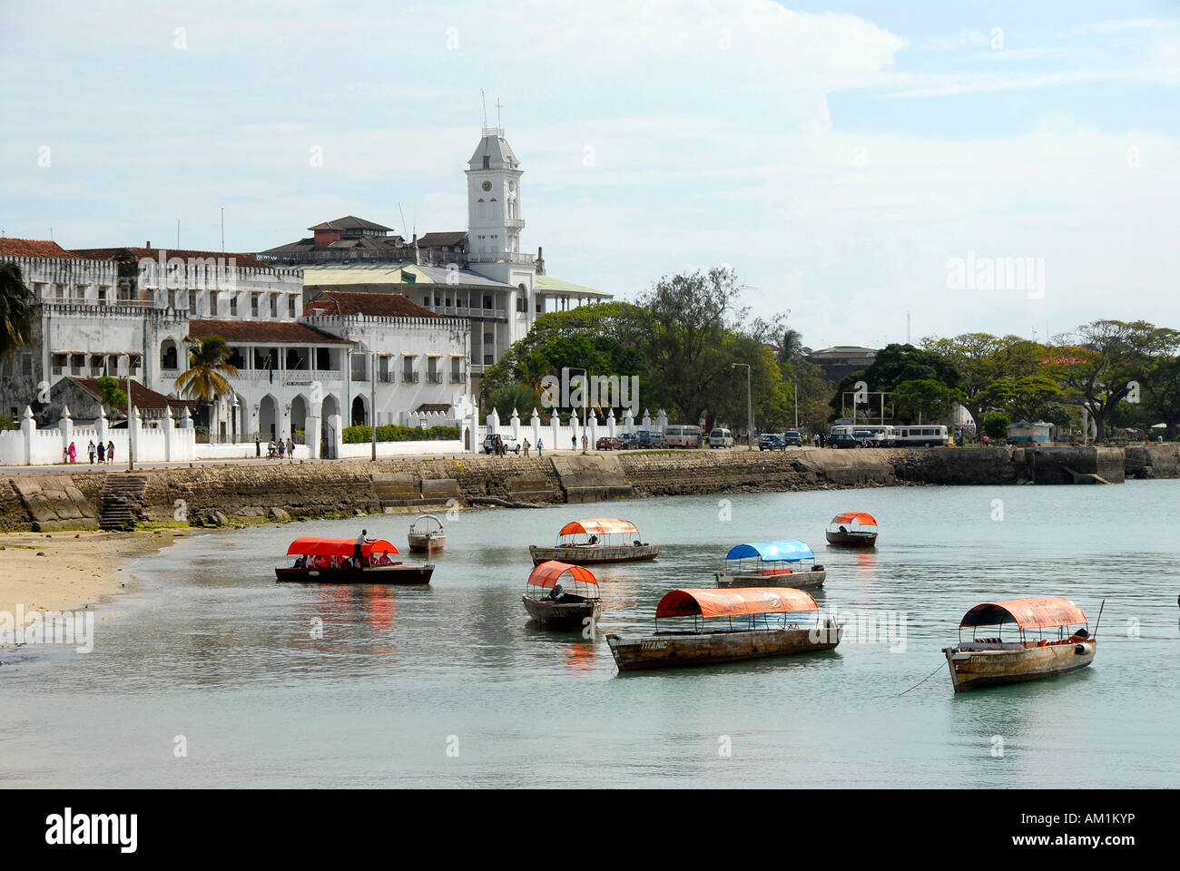 View of the city with Beit el-Sahel Palace Museum and boats Stone Town Zanzibar Tanzania Stock Photo
