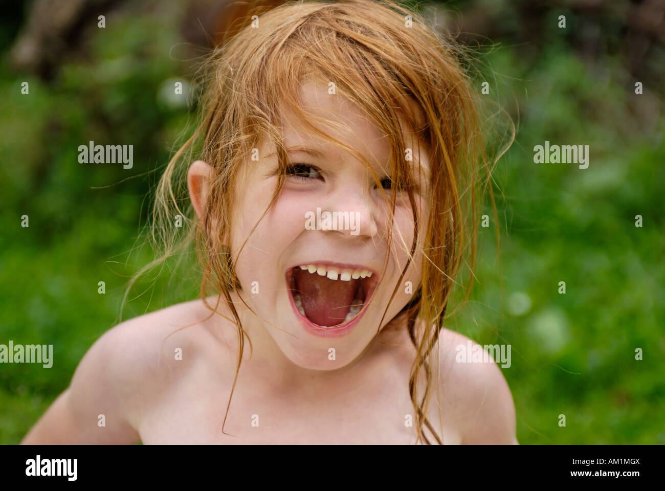 Little girl cries shouts screams very loud Stock Photo