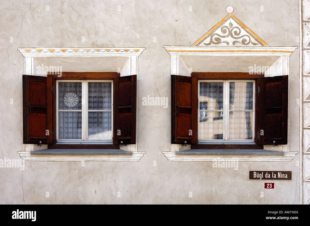 Windows of an Engadine house decorated with Sgraffito ornaments, Samedan, Engadin, Grisons, Switzerland Stock Photo