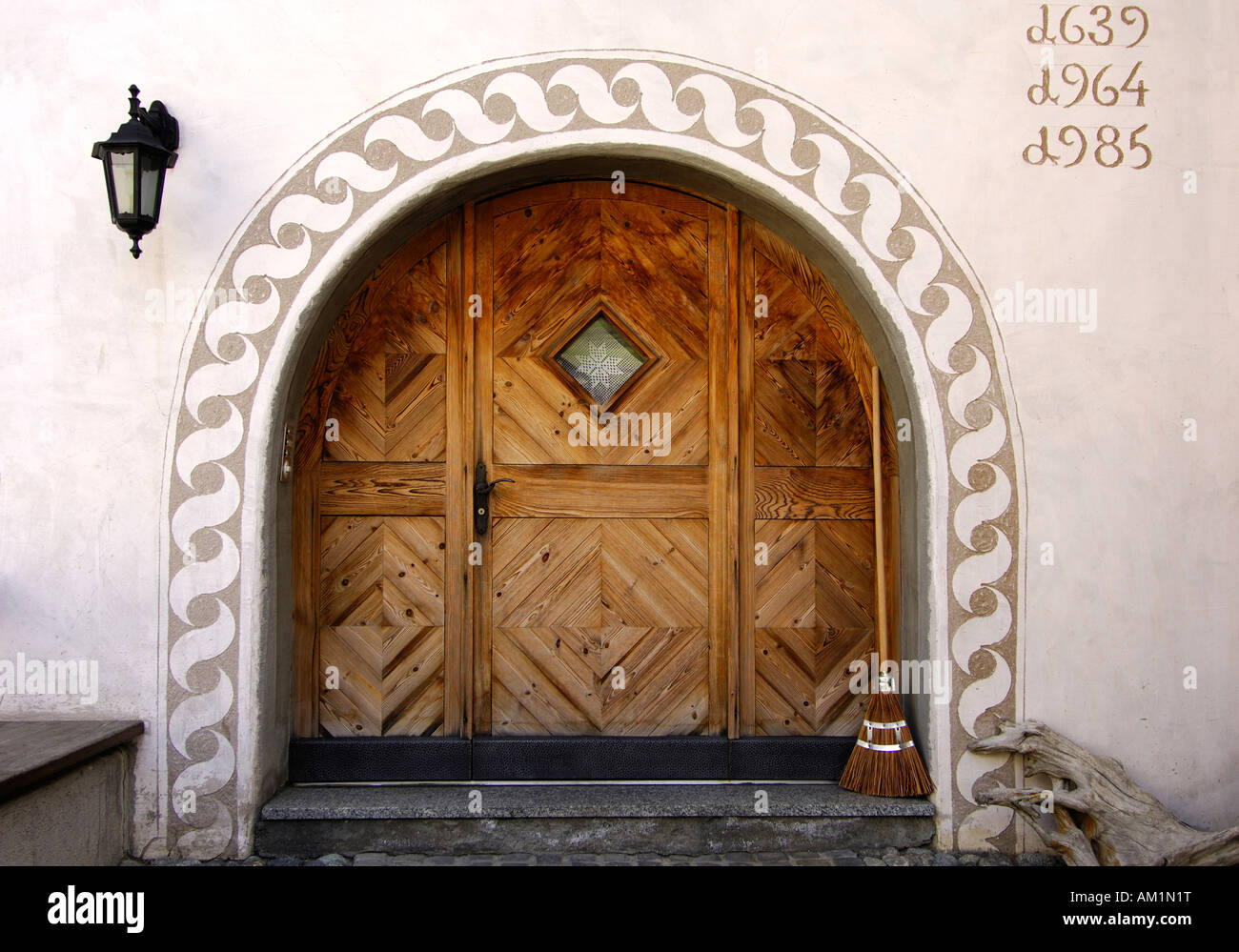 Entrance of an Engadin house decorated with Sgraffito ornaments from the 17th centuary, Samedan, Engadin, Grisons, Switzerland Stock Photo