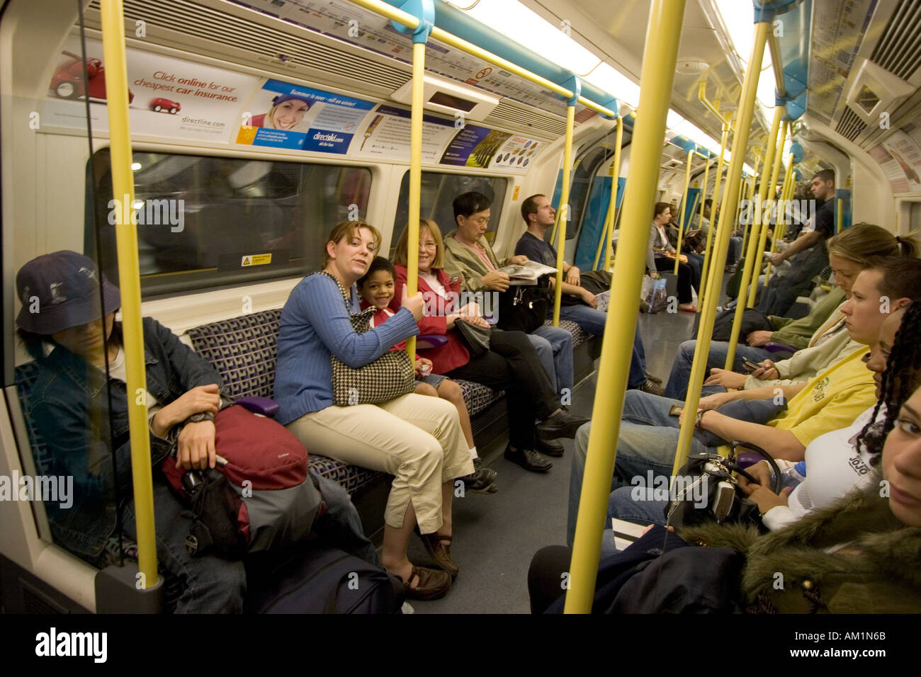 Passengers in London Underground train carriage Stock Photo - Alamy