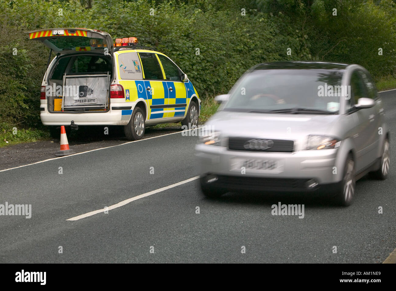 police car checking motorists speed with a mobile speed camera unit Stock  Photo - Alamy