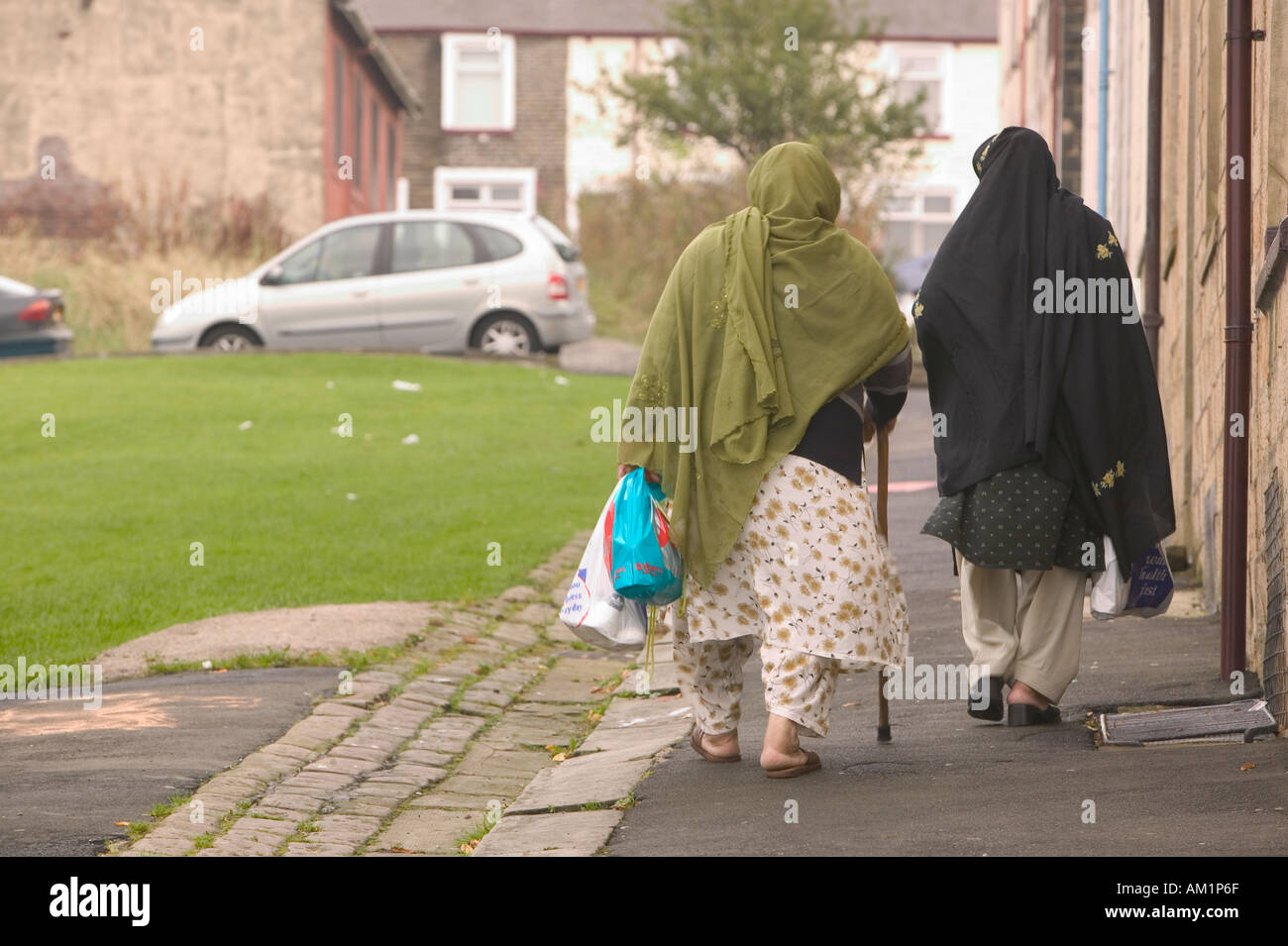 Pakistani ladies in traditional dress on the streets of Brierfield Nelson Lancashire Stock Photo