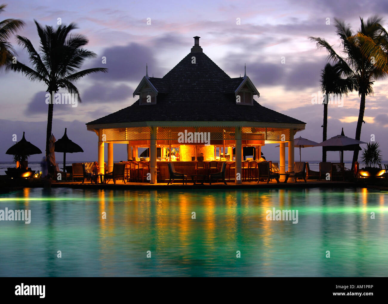 Twilight at the pool bar, Hotel Le Telfair, Mauritius Stock Photo - Alamy