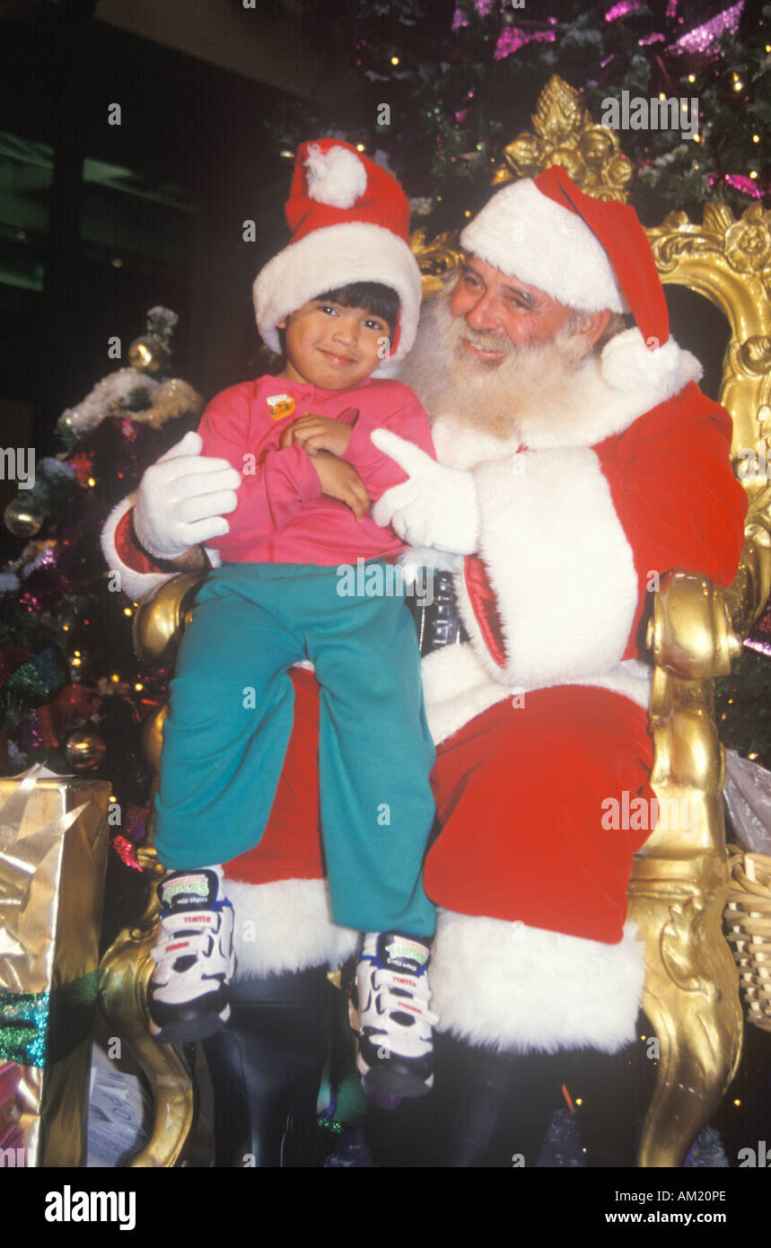 Santa Claus with Mexican American Boy Santa Monica California Stock