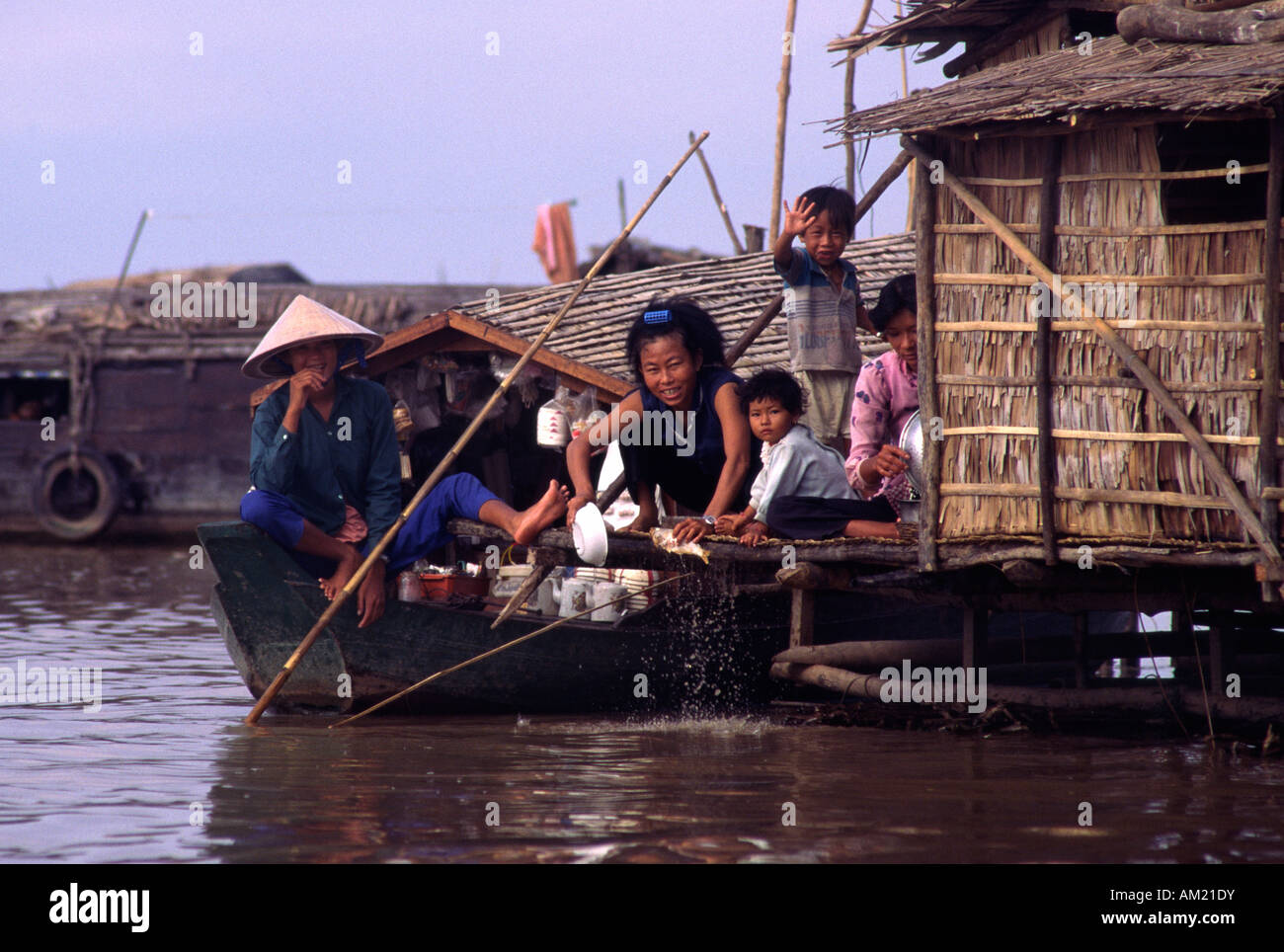 Vietnamese people living in a floating village. Tonle Sap, Cambodia. Stock Photo