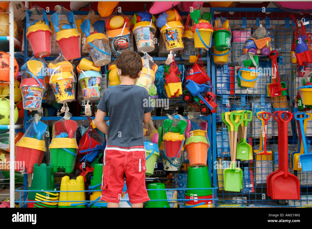 Child at a toy stand, Mallorca, Spain Stock Photo