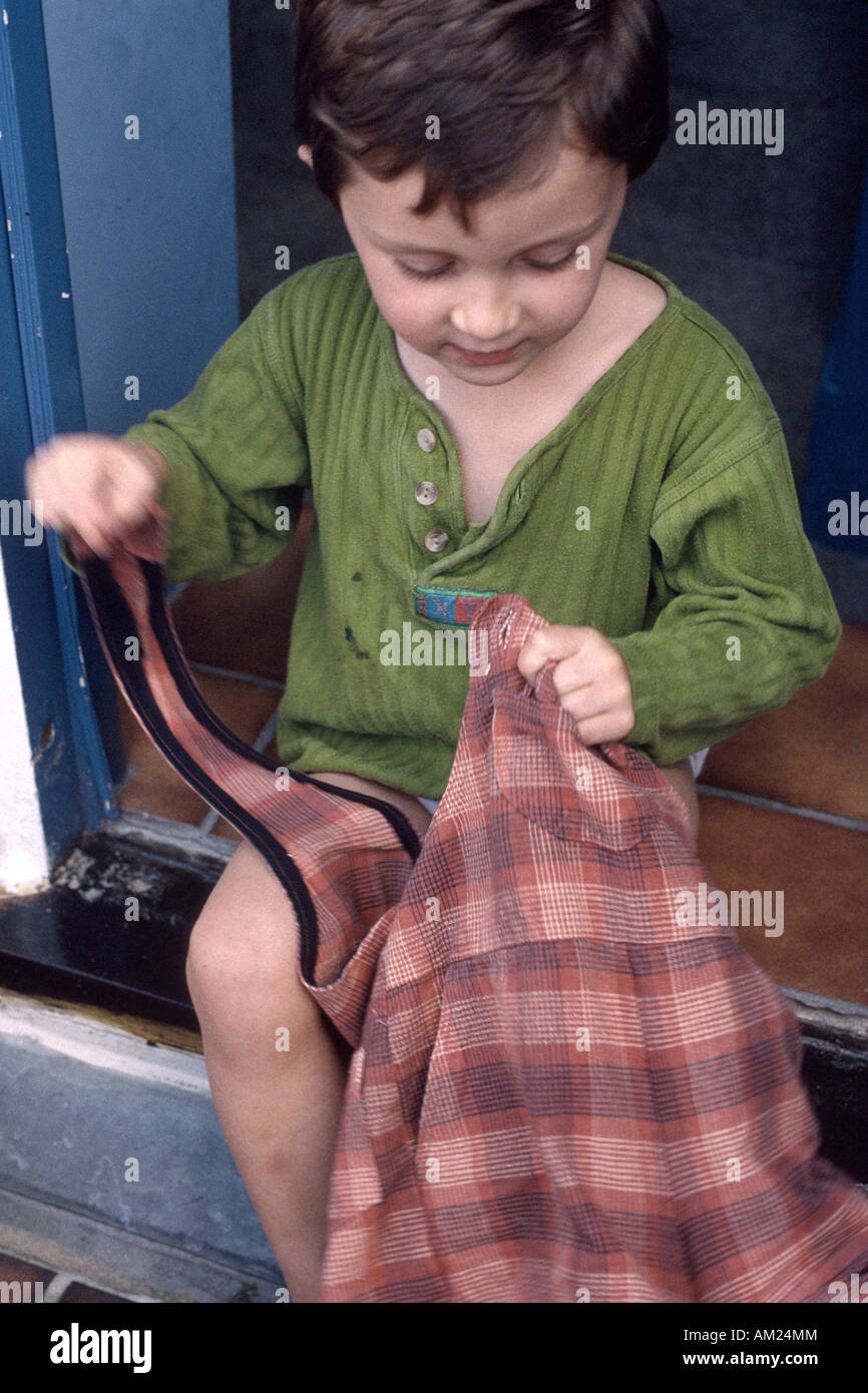 Three Year Old Girl Buttoning Her Jumper Stock Photo Alamy three-year-old-girl-buttoning-her-jumper-stock-photo-alamy