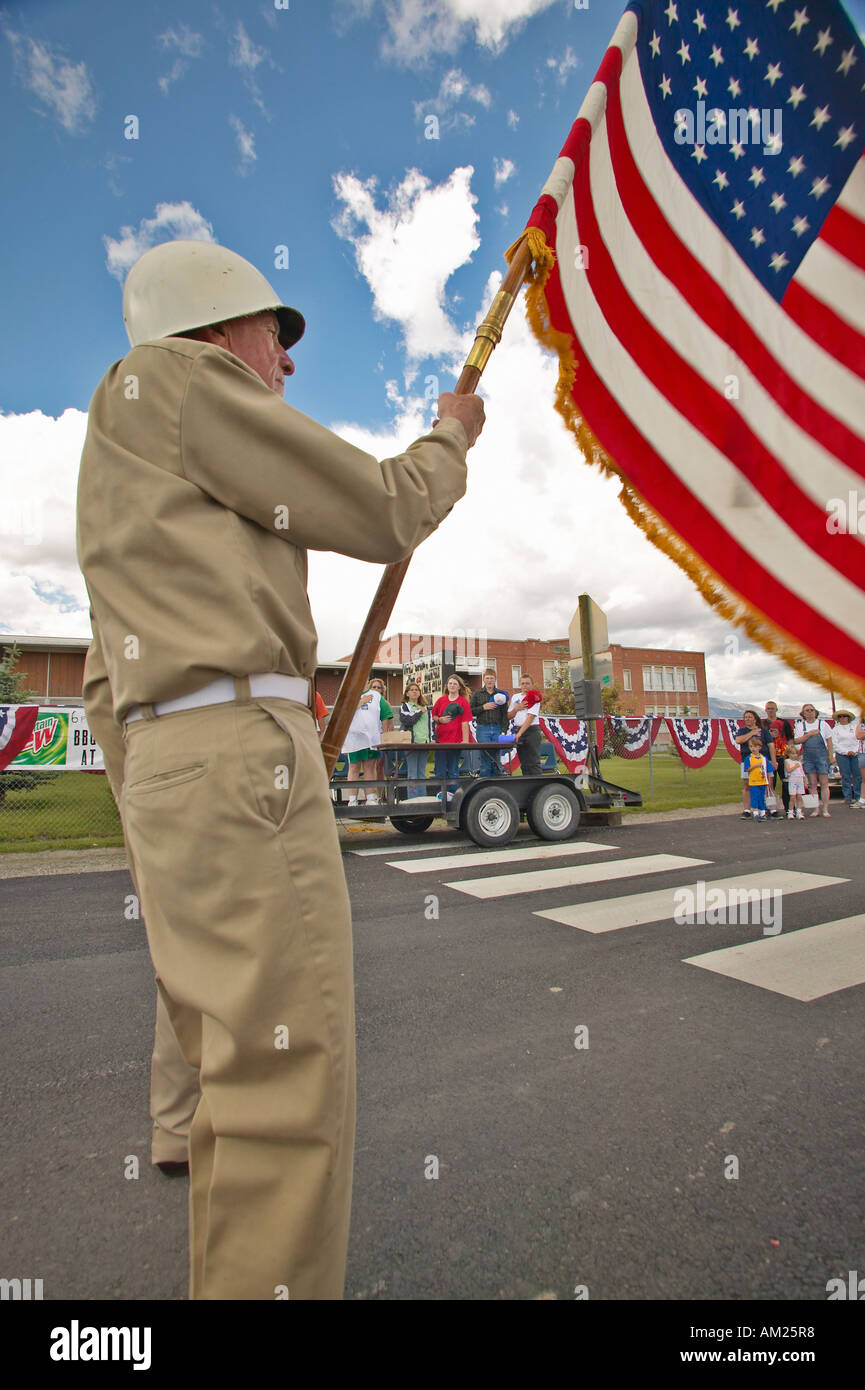 Member of a color guard carrying an American flag in Lima Montana Stock ...