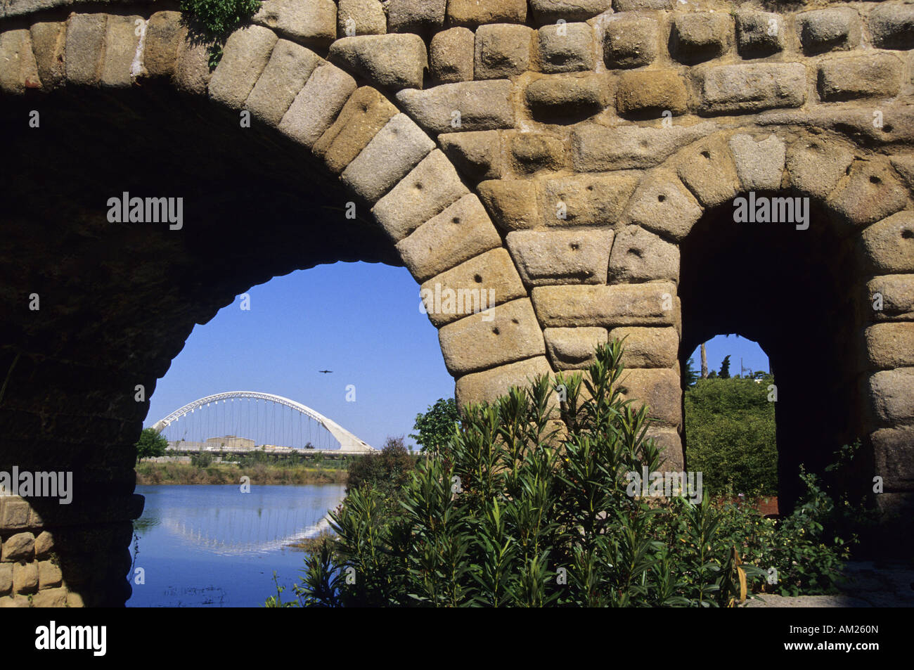 Roman bridge and Lusitania bridge by architect Santiago Calatrava over Guadiana River MERIDA Badajoz Extremadura Spain Stock Photo