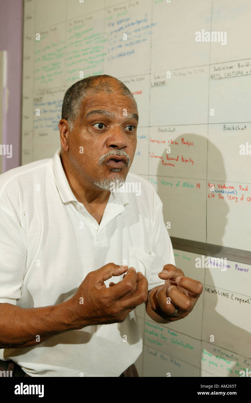 Man talking about planning, Bush Radio, Cape Town, South Africa Stock