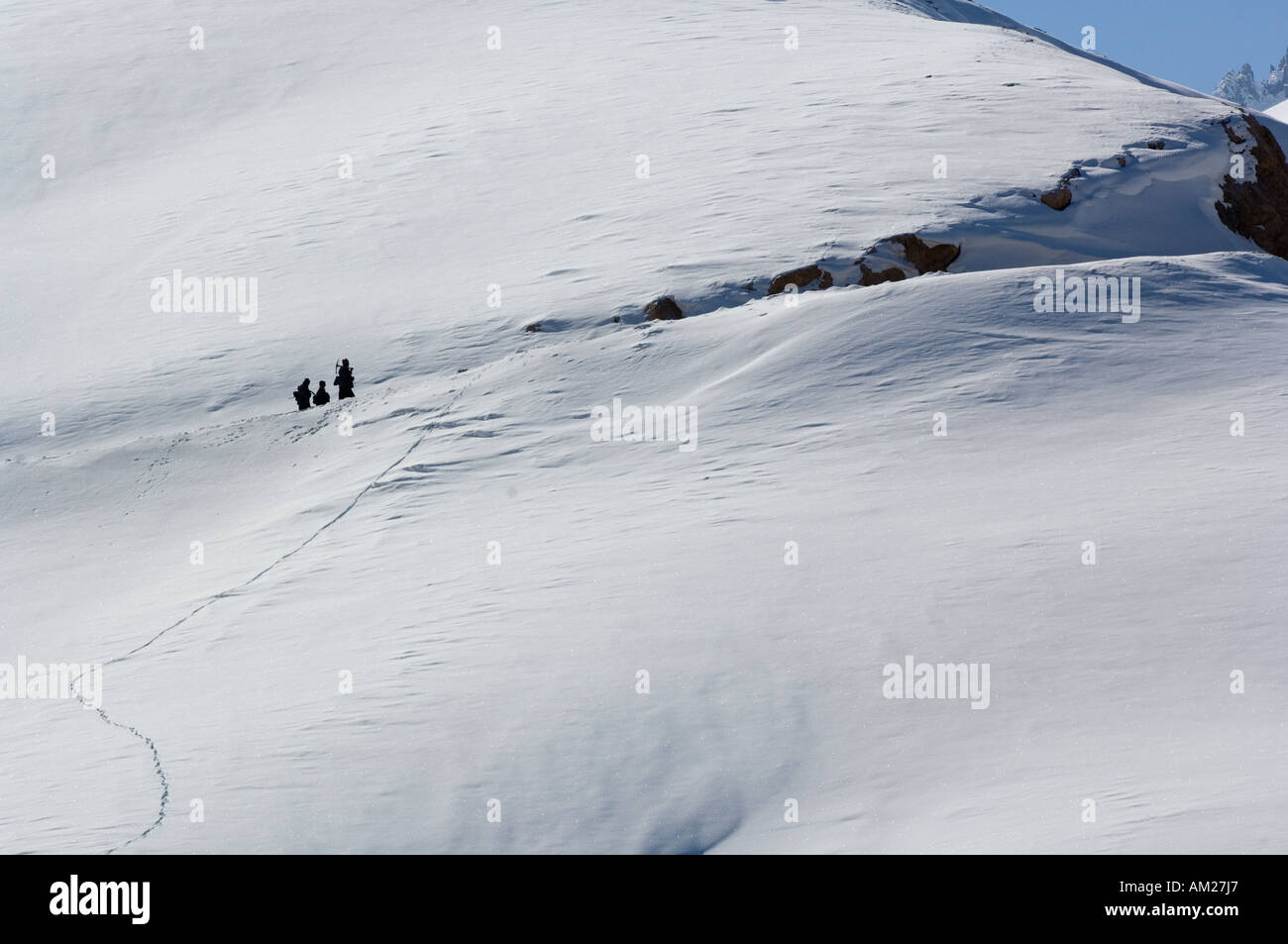 himalayan snow scene with travelers Stock Photo