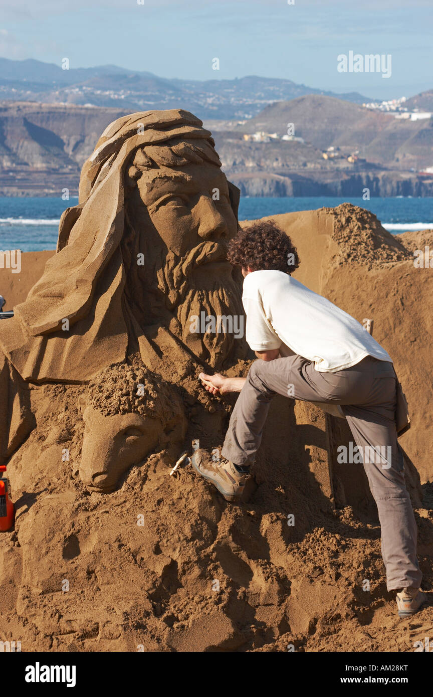 Sand sculptor working on nativity scene, Las Canteras beach, Gran ...