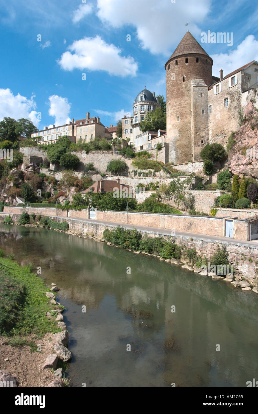The River Armançon and one of the historic medieval towers of the old ...