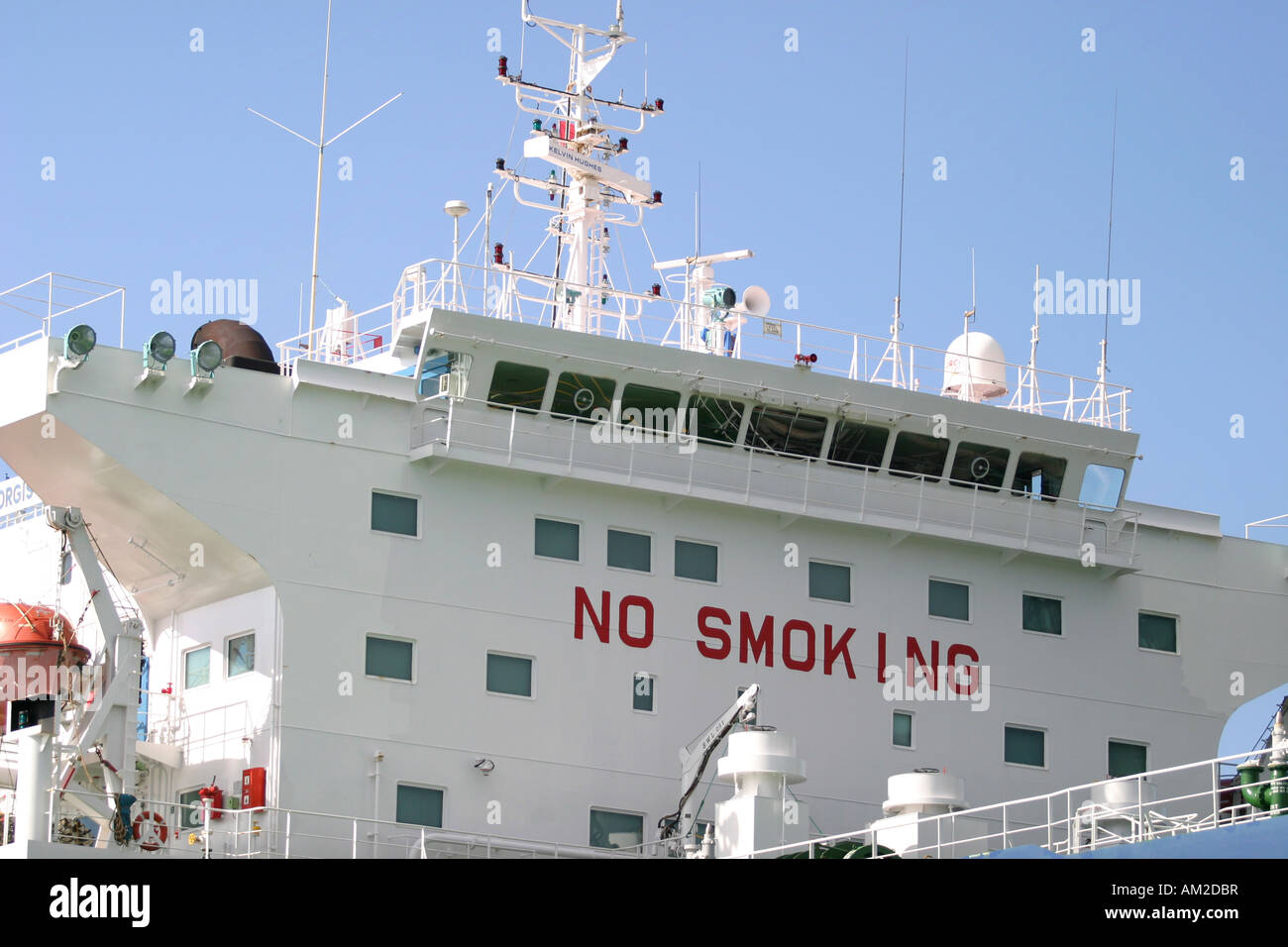 Oiltanker in Harbour with no smoking on it Stock Photo