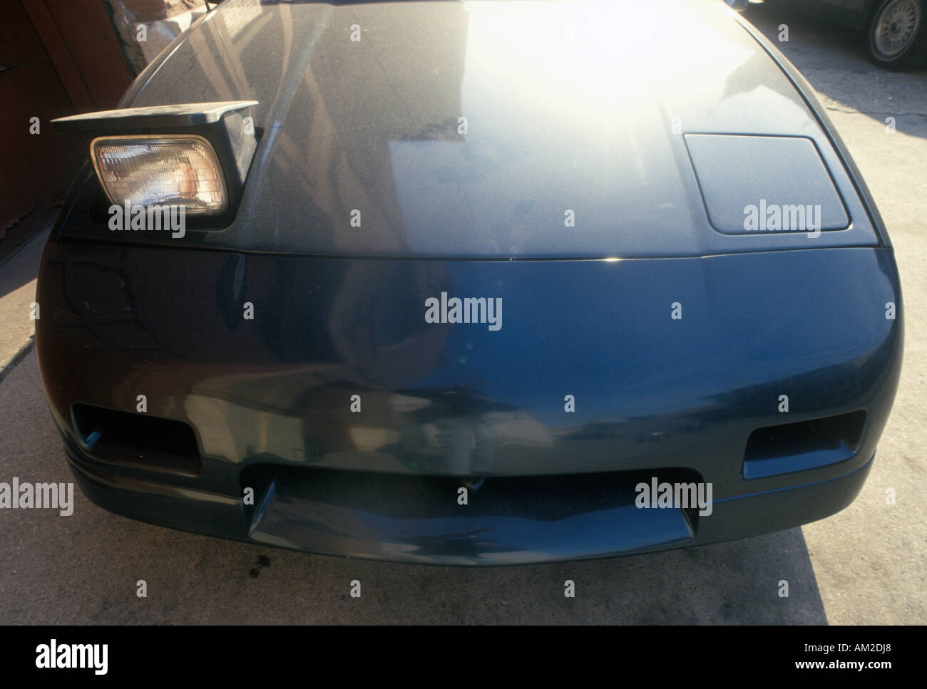 A Pontiac Fiero in Chicago Illinois with one headline blinking Stock Photo