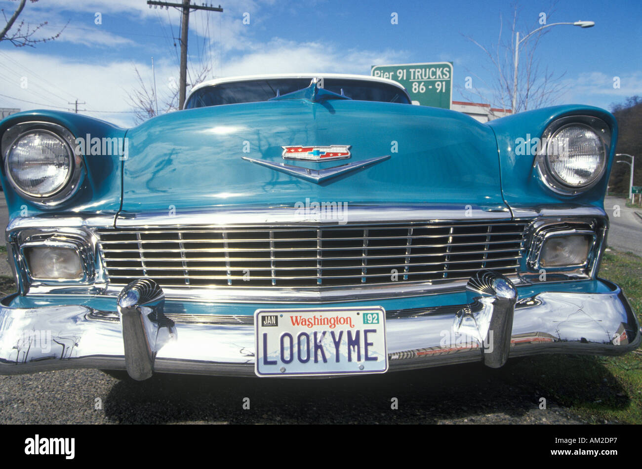 A 1956 Chevy with license plate that reads LOOKYME Stock Photo
