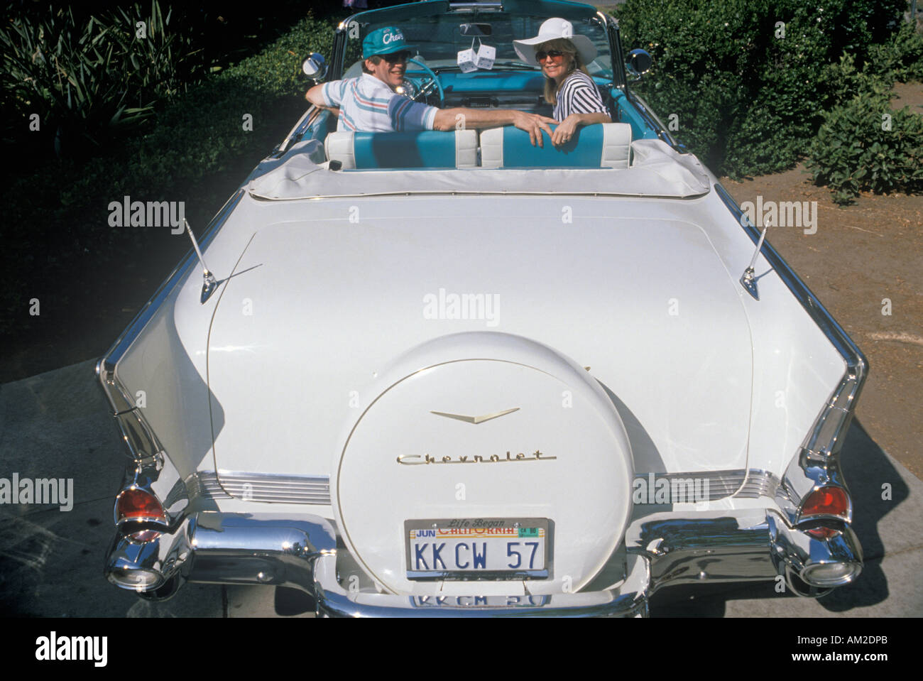 Kenny Kragen and wife in a white 1957 Chevrolet in a Beverly Hills Car Show in Los Angeles CA Stock Photo