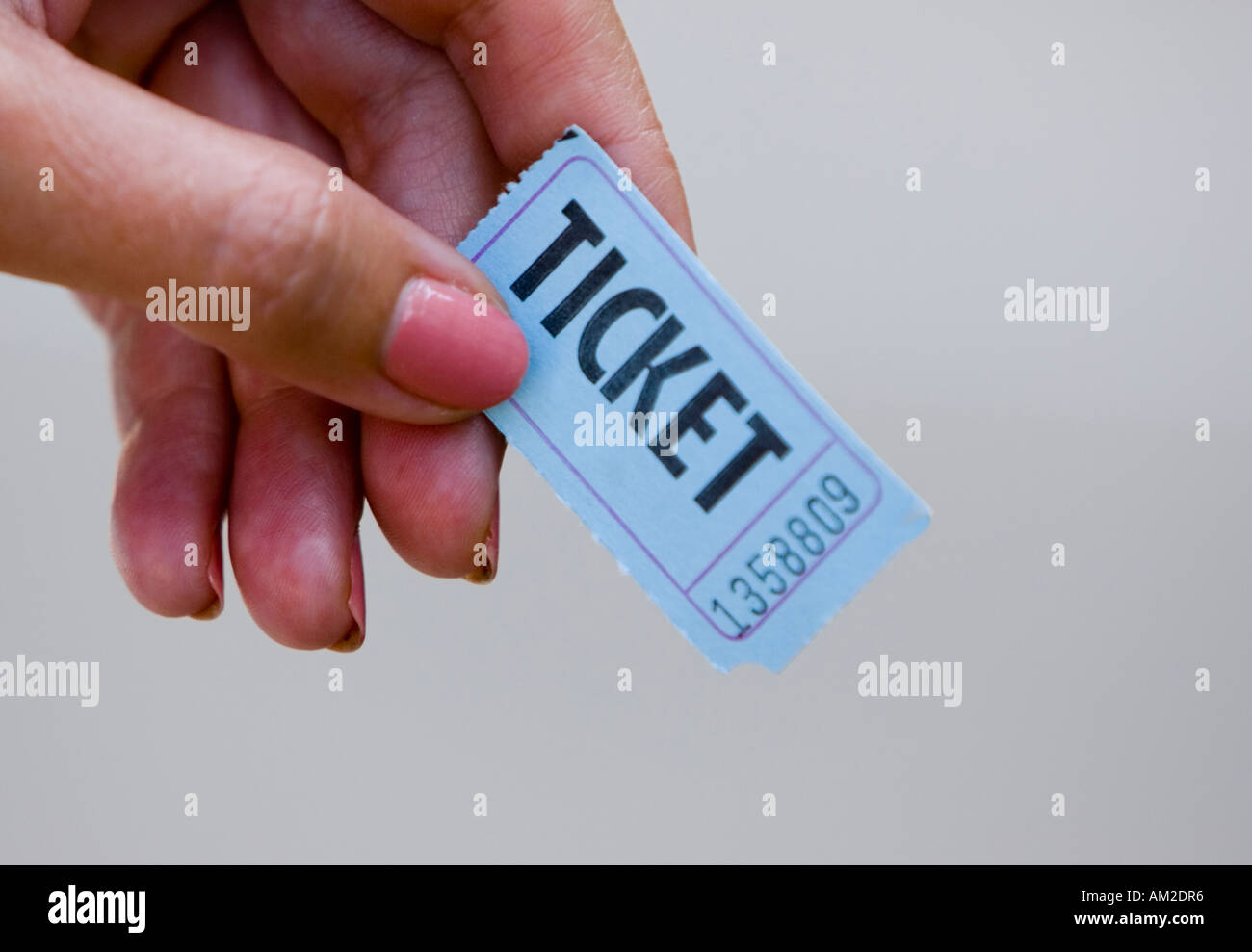 Woman holding a ticket Stock Photo