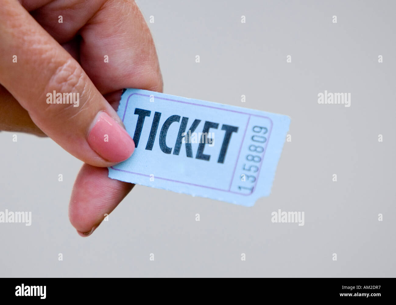 Woman holding a ticket Stock Photo