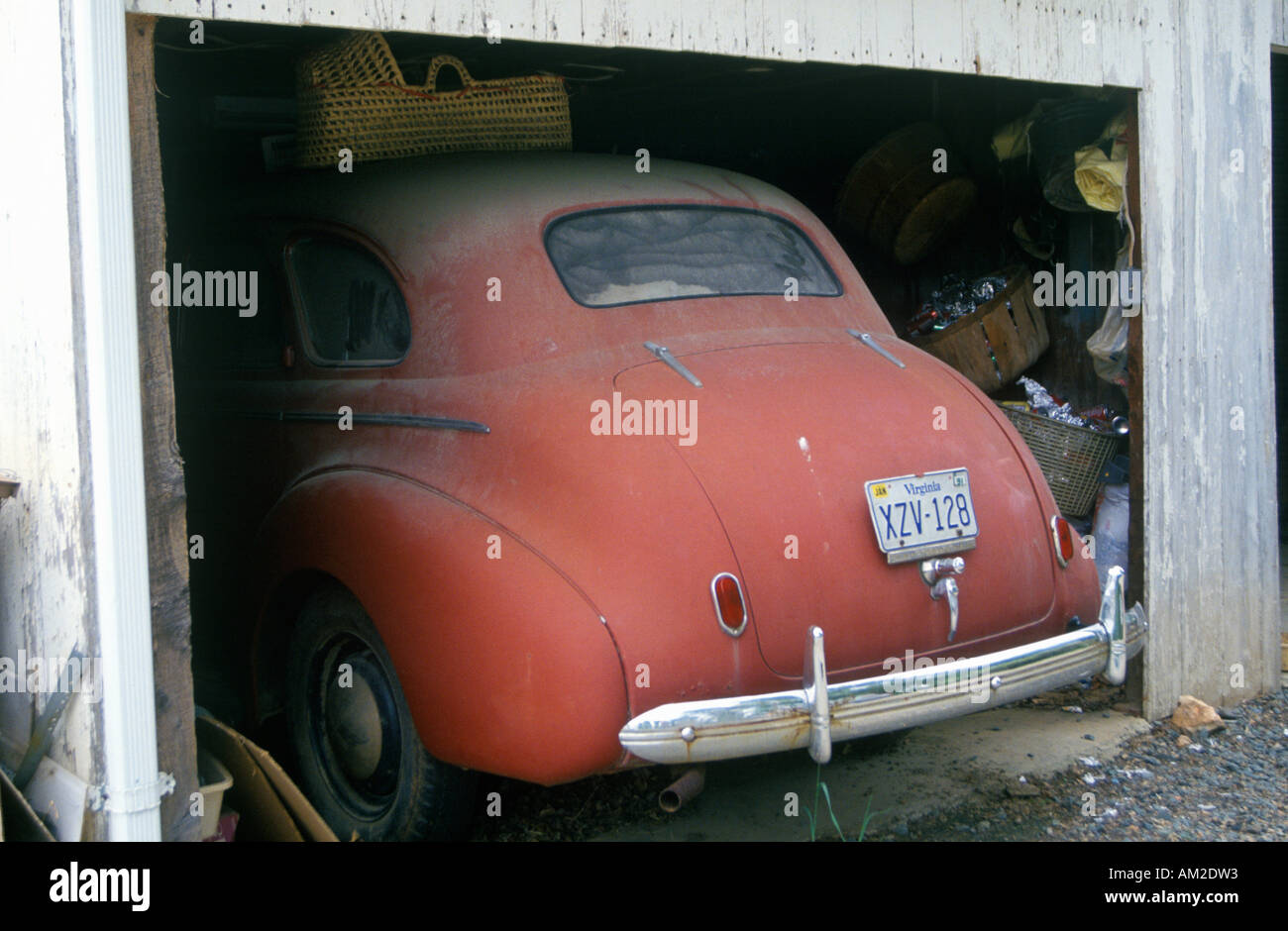 The rear of an old American car sticking out of a garage in Virginia Stock Photo