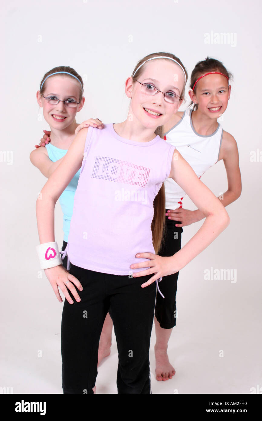 girls do pose and acrobat in white cutout background happy classmate kids acting Stock Photo
