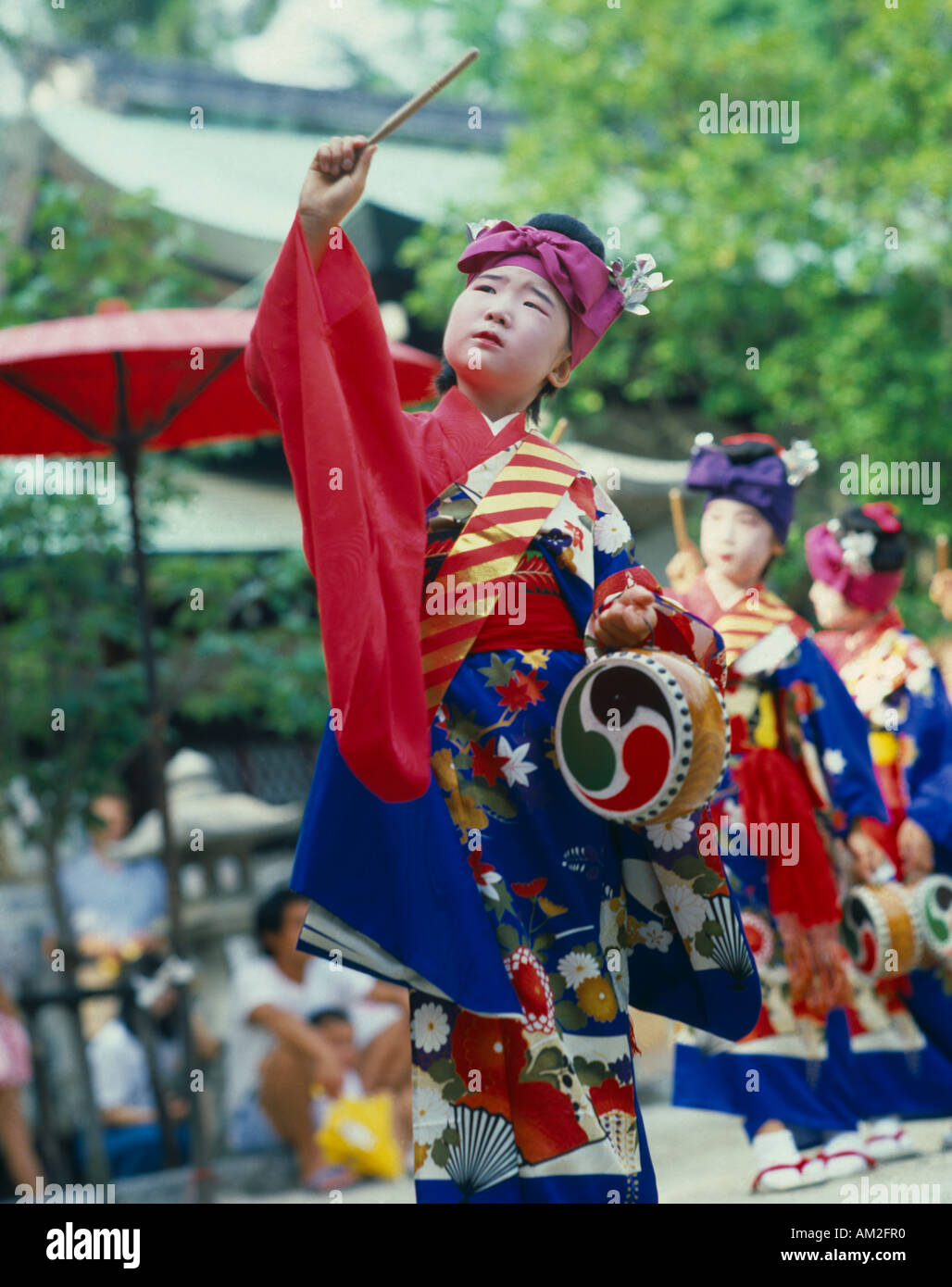 JAPAN Honshu Kyoto Young boy in costume with drum and stick at the