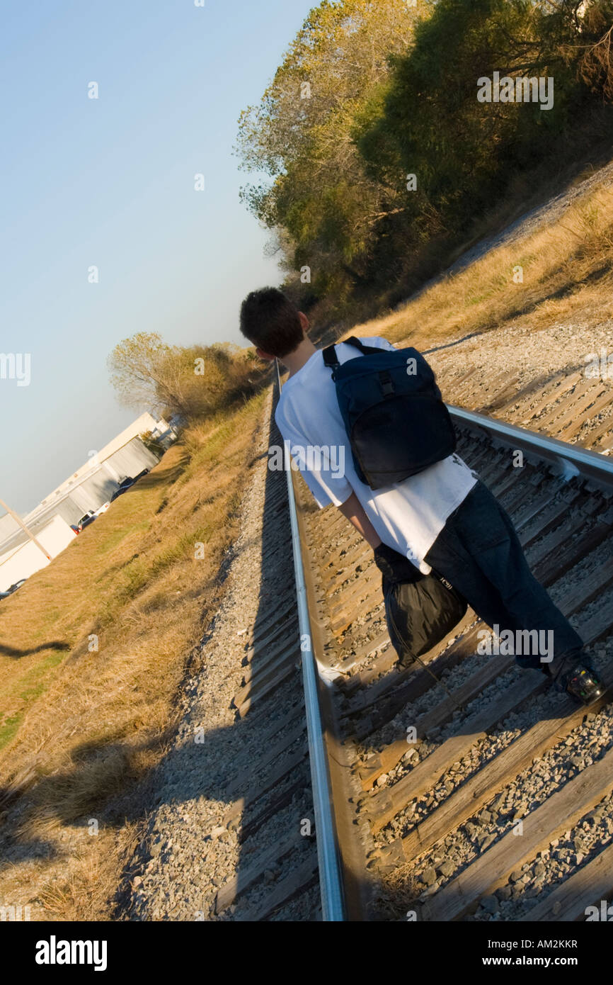 A 13-year-old caucasian boy runs away from home. USA. Stock Photo